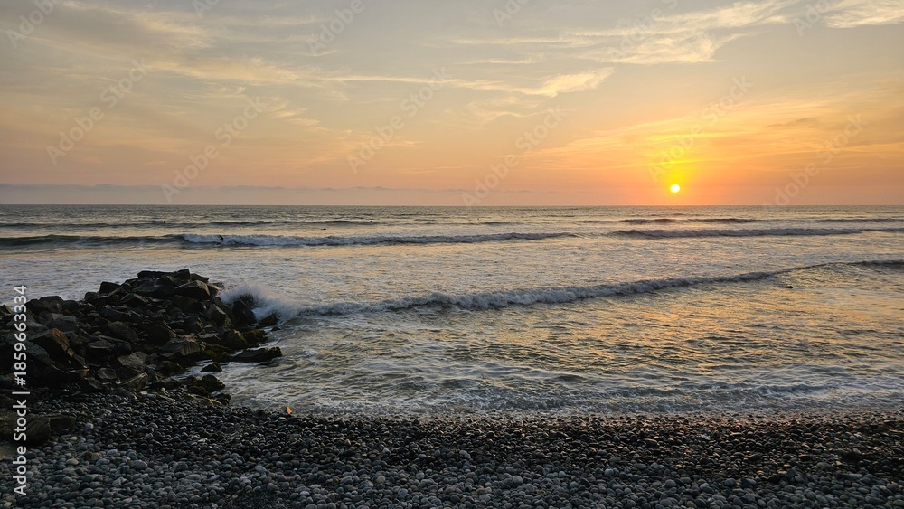 Fototapeta premium Sunset at La Pampilla beach, a known beach and surf spot in Lima, Peru.