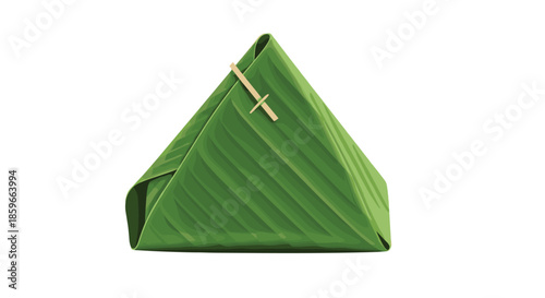 Traditional food item wrapped in a fresh green banana leaf in a triangular shape and secured with a small stick.