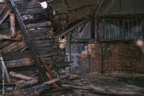 Wallpaper Mural Interior view of a collapsed roof and structural damage in a derelict industrial building. Visual representation of architectural failure and urban decay in a forgotten warehouse. Torontodigital.ca