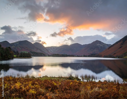 Autumn lake sunrise over mountains