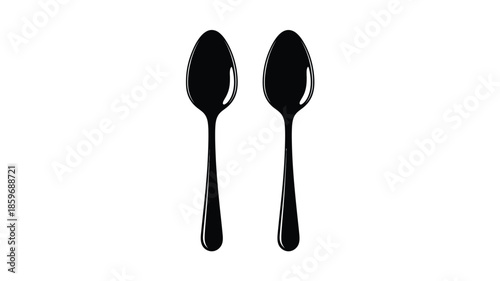 Two black spoons presented on a white background simple kitchen utensil image