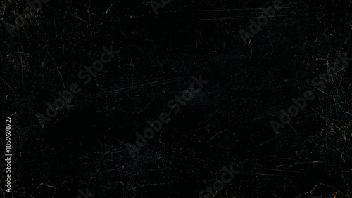 Scratched and distressed black surface texture with visible marks