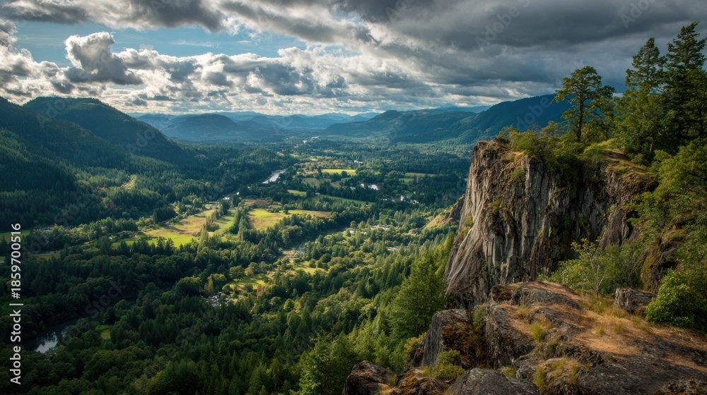 Fototapeta premium Dramatic Landscape - Cliffside View of Lush Valley and Cloudy Sky.