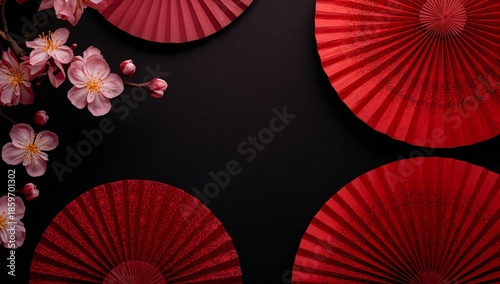 Red Fans and Cherry Blossoms in Traditional Japanese Setting With Dark Backgr...