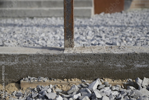 Concrete strip foundation prepared for fence installation, showing reliable base, construction process, and durable groundwork. High quality photo