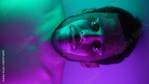 Male Portrait Submerged in Water with Neon Glow