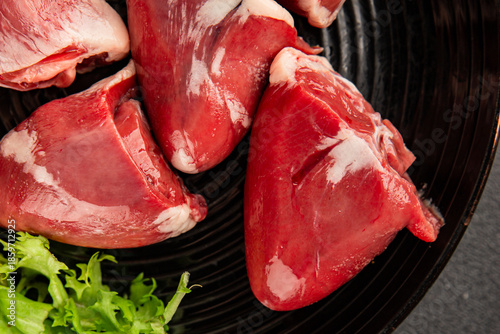 Quadro su tela Turkey heart offal meat tasty snack fresh delicious gourmet food background on t