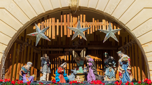 Nativity Scene In A Wooden Stable With Stars And Figures Of Mary, Joseph, And The Nativity Baby Jesus