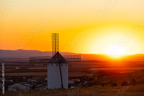 Historic windmill standing at sunset in Campo de Criptana