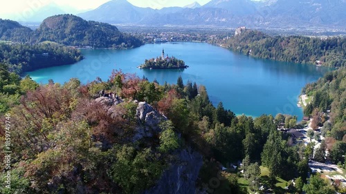 Aerial panorama of Lake Bled with island and autumn foliage, Slovenia