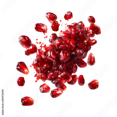 Exploding red pomegranate seeds isolated on transparent background