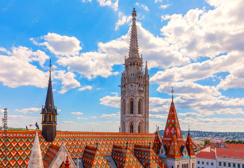 Naklejka premium Matthias Church and its roof on Castle Hill, close view at sanny day, Budapest, Hungary