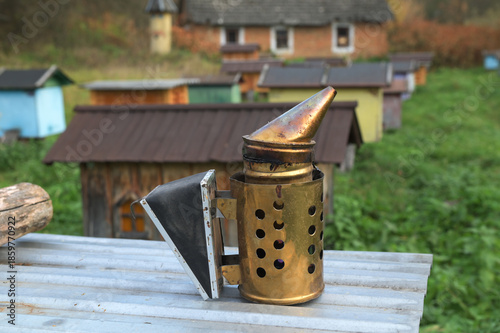 Beekeeping smoker tool on apiary, close-up