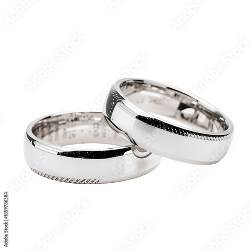 Two Silver Wedding Bands Placed Next to Each Other on a Flat Surface in a Sim...