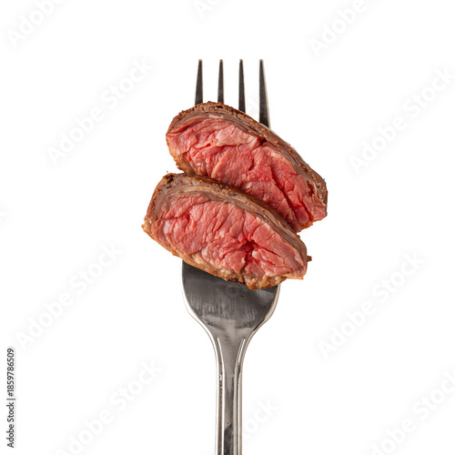 Delicious Pieces of Steak on Fork Ready to Be Enjoyed After Cooking