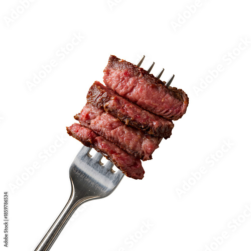 Slices of Beef on a Fork Ready to Be Served After Cooking in a Kitchen