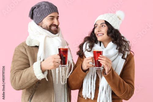 Happy young couple in warm ...
