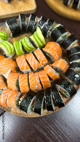 Homemade fish rolls, sushi close-up on a plate	
