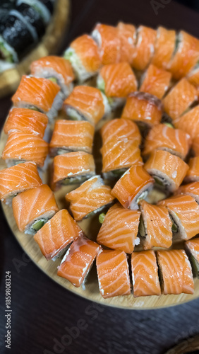 Homemade fish rolls, sushi close-up on a plate
