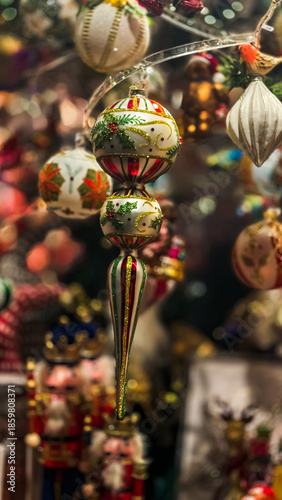 A close-up of a display case with Christmas tree decorations at a Christmas market 