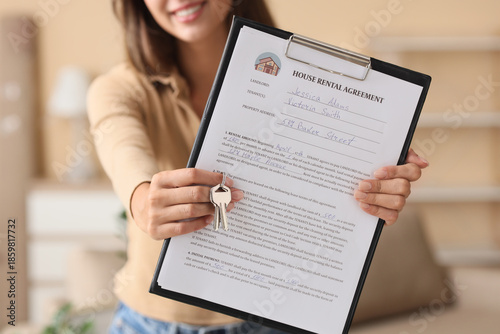 Young woman with house rent...