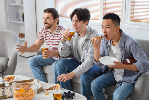 Male sports fans with beer ...