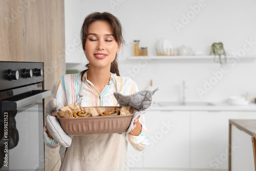 Young woman holding freshly...