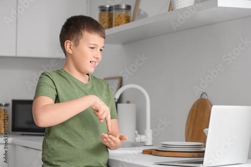 Mute boy using sign languag...