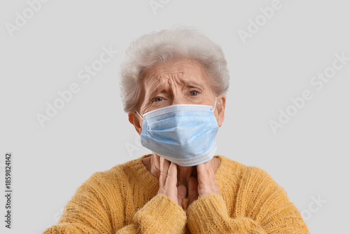 Sick elderly woman in medic...