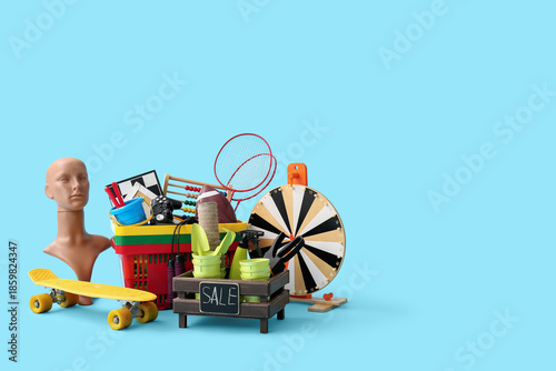 Photos Unwanted stuff for garage sale on blue background