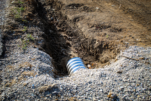 Bild auf Leinwand a culvert pipe installed in an excavated ditch area near construction