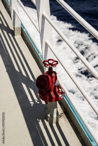 A small red hydraulic water