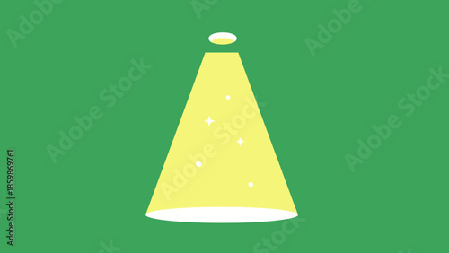 A bright yellow spotlight shines down from above, illuminating a green background with small white sparkles.