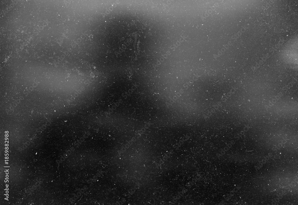 Obraz premium Monochrome silhouette of an adult figure seen through a speckled glass surface, creating a moody urban night scene full of mystery, introspection, and cinematic atmosphere