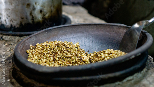 Roasting coffee in the traditional way and using pottery (Indonesian call it kreweng)