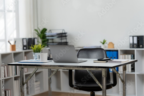 Modern Workspace with a laptop and accessories: The image shows a modern workspace featuring a sleek laptop, essential office accessories, and clean aesthetics for productivity.