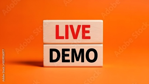 Two wooden blocks stacked on an orange background, with 'LIVE' in red and 'DEMO' in black, signifying a live demonstration.