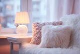 A cozy bedroom scene features a warm lamp, fluffy pillows, and a comfortable armchair bathed in soft, pink light.