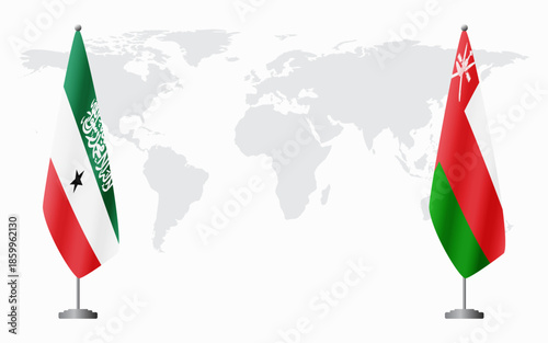 Somaliland and Oman flags for official meeting against background of world map.