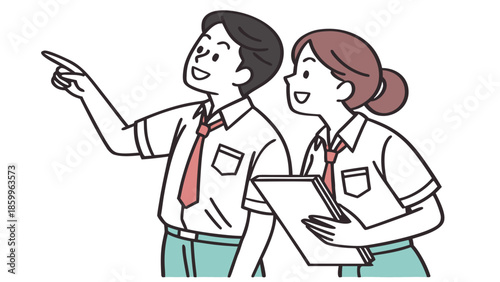 Two students in uniform collaborating and pointing together.