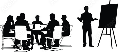 Black silhouettes of business people sitting at table with laptops during presentation by a speaker near easel on white background.