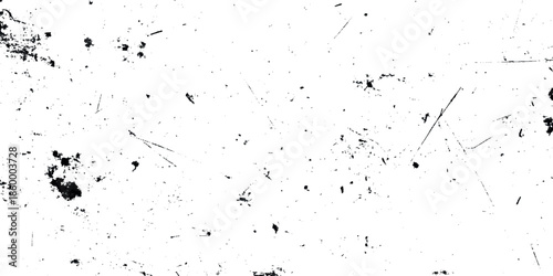A distressed grunge texture with scattered dark spots and subtle linear scratches on a white background