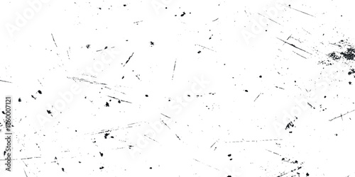 An abstract grepsny white texture with scattered dark specks and thin irregular lines throughout the frame