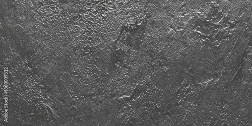 A stark monochromatic image displays a highly textured surface resembling weathered rock or abstract dark matter