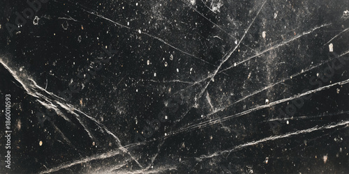 A striking close up view showcases a dark textured surface with prominent white vein like patterns throughout