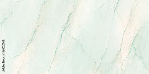 A close up of a light green and white marble texture with delicate veins running throughout the surface