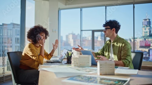 Worried team talking smartphone in construction agency office. Woman calling