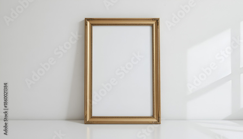 Empty Gold Frame Hanging on White Wall Mockup