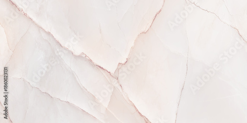 A stunning close up of a delicate pale pink marble texture with subtle veining and natural patterns