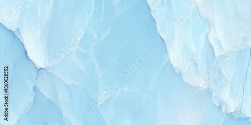 A serene and calming light blue marble texture showcasing natural veining patterns and a smooth polished surface